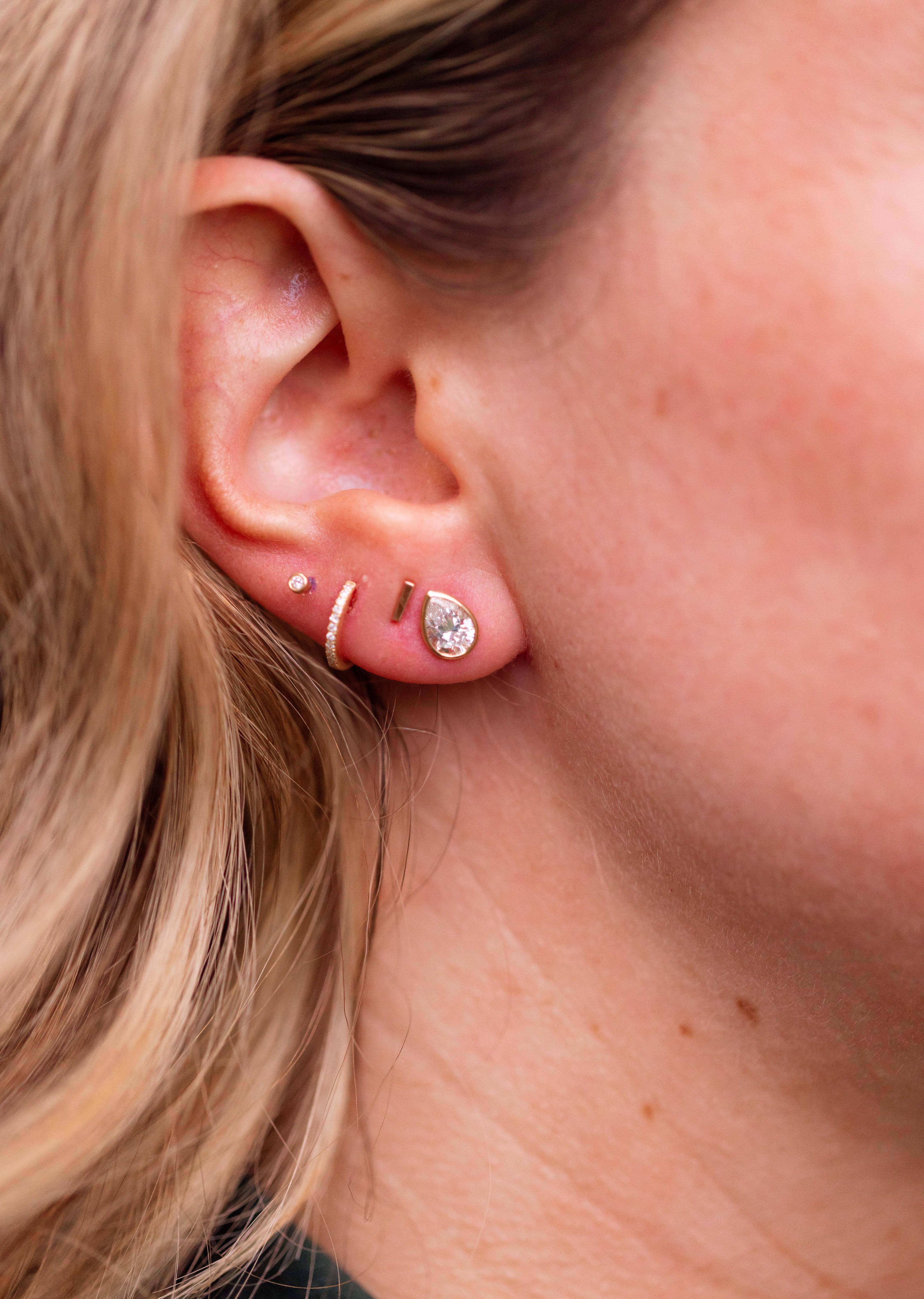 Lab Grown Diamond Bezel Pear Studs 14k Yellow Gold - 1.00ctw modeled
